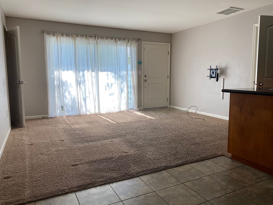 Living room, front door, patio door, view from dining room