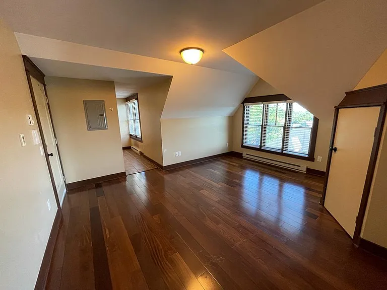 View to liiving room and kitchen from bedroom door