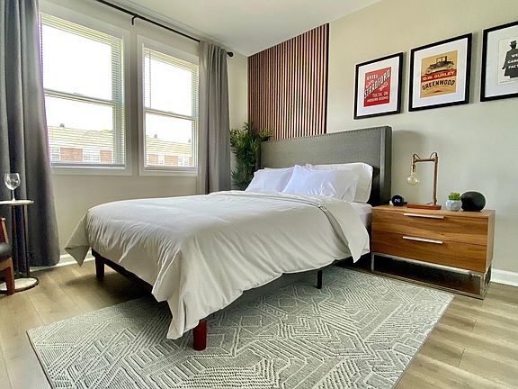 Bedroom 1 (queen bed, ceiling fan)