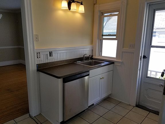 Dishwasher, stainless steel sink with food waste disposer.