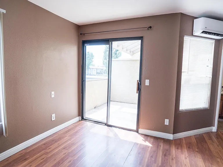 Private deck/patio area outside. AC and heat unit operated with remote control conveniently placed close to the bedroom space.
