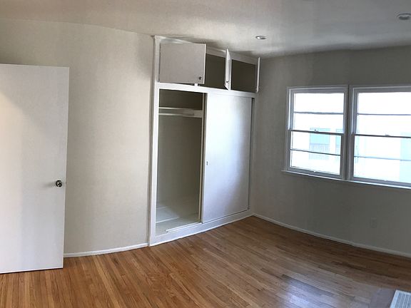 New hardwood floors for the bedroom with dimmable LED recess