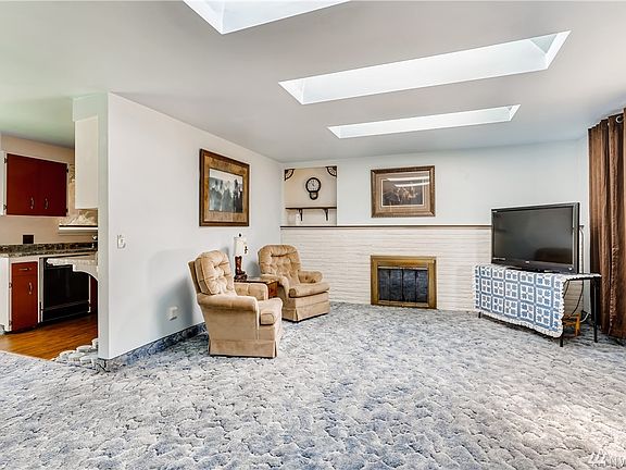 As you enter the home you are welcomed by a light and bright living room. 