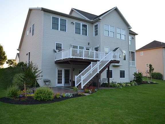 Rear view
						:
						Walk out basement, stamped concrete patio, trex deck and beautifully landscaped