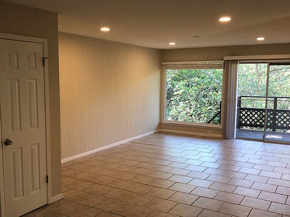 First floor Living Area with 6'x6' picture window and sliding glass door to first floor deck.
