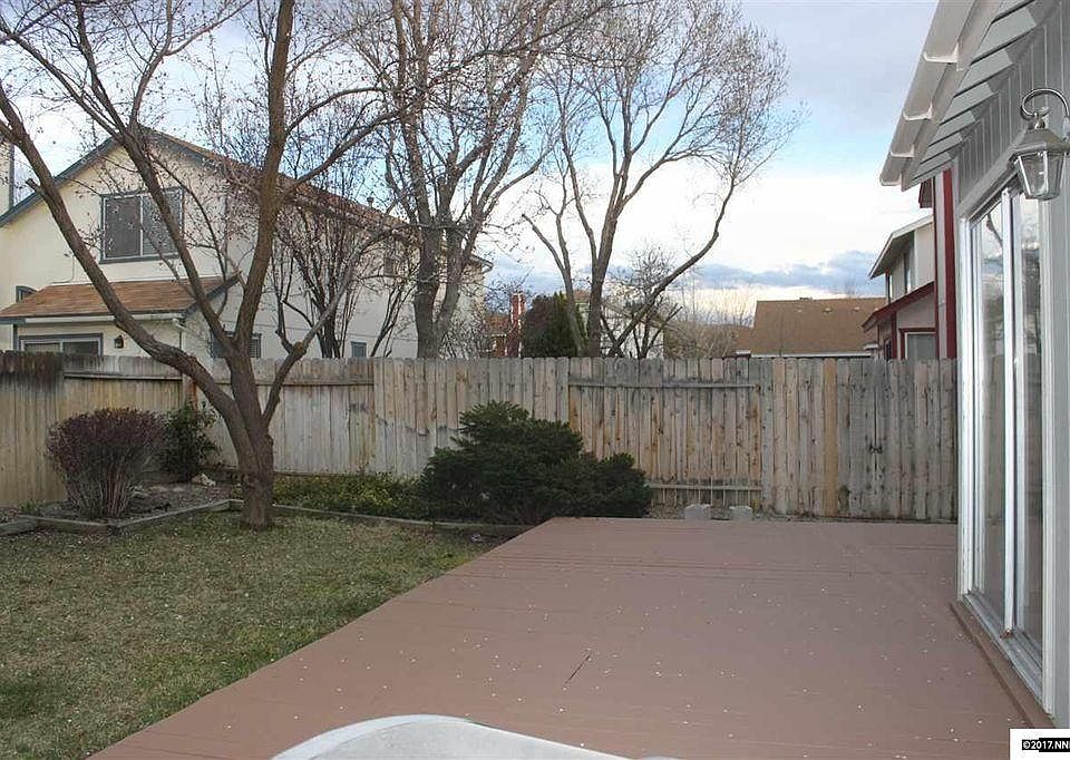 Sliding glass doors from dining area to backyard deck