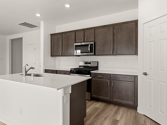 A spacious island is perfect for meal preparation.