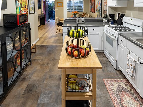 The kitchen is fully equipped. Appliances include a food processor, highspeed blender, mixer, hand blender, an InstaPot, milk frother, and electric kettle. A wide array of cooking utensils, baking dishes, and pots and pans are also provided.