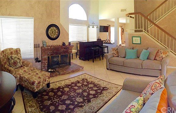 Oh my!!! Look at this family room with so much natural light, vaulted ceilings perfect for entertain