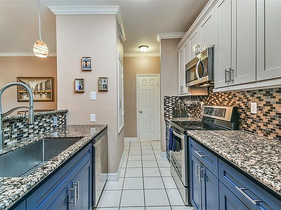 New appliances and custom painted cabinets make this kitchen unique and fresh.