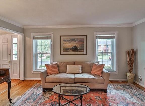 View of living room and entry from adjoining family room