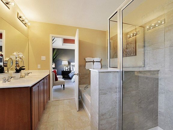 Owner's Bath with Double Vanities and Separate Tub and Shower