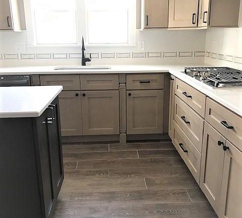 Kitchen with large primary sink facing backyard