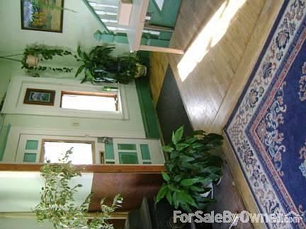 Entry Way oak floor stairs to 2nd flr
						:
						Bright entry near wood stove (on left) opens to stairway and 4 BD, 1 BA upstairs