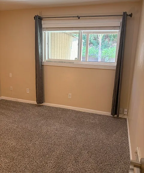 Bedroom number 2 adjacent to master. Uses hallway bathroom. Large closet (not shown on photo). Beautiful view of private back yard.