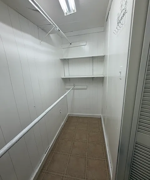 inside the walk-in closet of bedroom 1