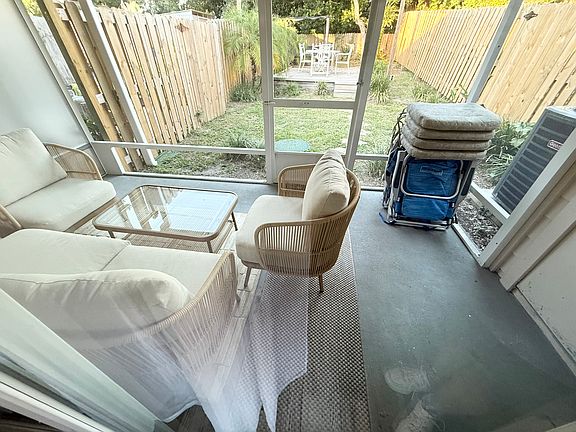 outside screened in patio and a nice yard
