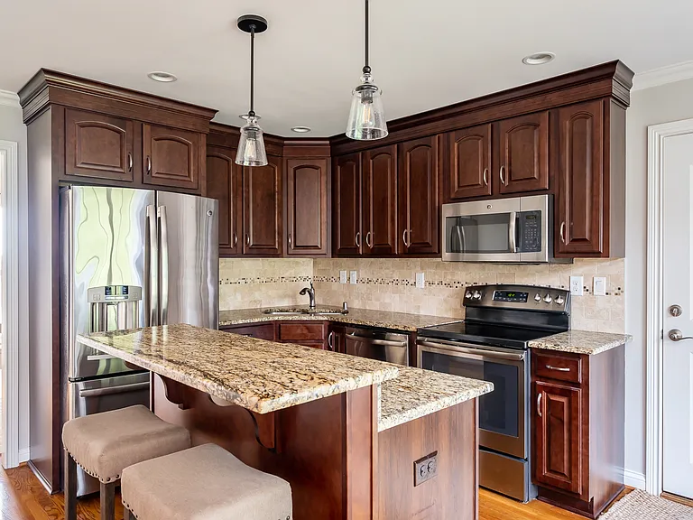 Kitchen 2 - The bi level counter top is replaced with a high quality flat quartz countertop. Picture will be updated.