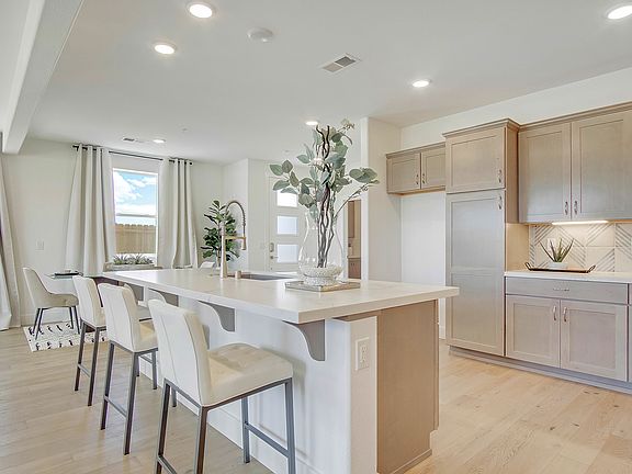 Kitchen island with undermount sink, upgraded cabinets.