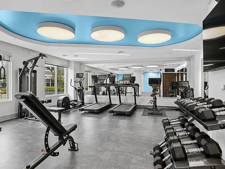 24 Hour fitness center with cardio and strength training equipment