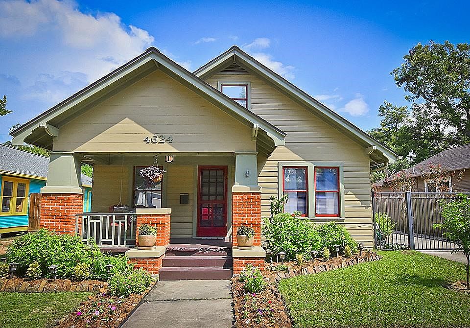 Tradition Heights bungalow with relaxing front porch, landscaping, and updated outdoor lighting.