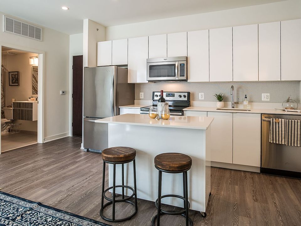 Renovated kitchen with stainless steel appliances and granite countertops