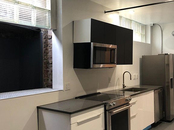 Windows in the kitchen allow lots of light to the space