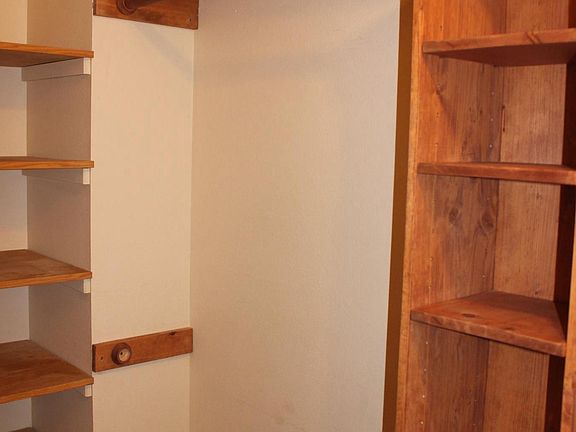 Master walk-in closet. Plenty of shelving and storage.