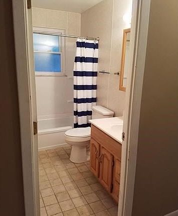 Full bath with built-in medicine cabinet and large linen closet