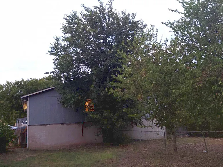 Very large backyard is fully fenced and not shared. Peaceful woods and dry creekbed beyond the fence. No neighbors behind you