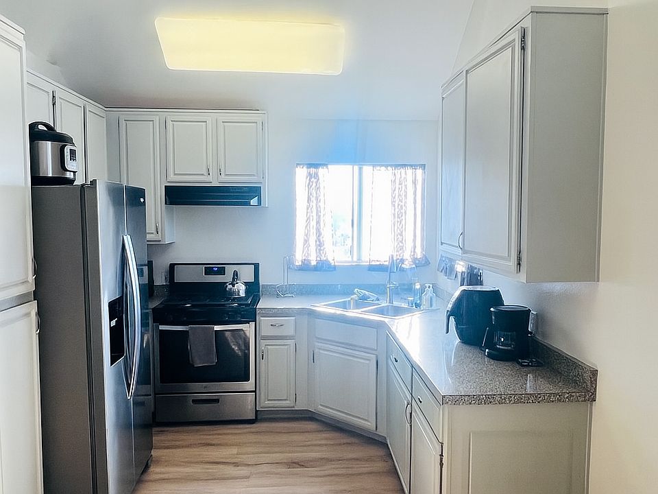 Newly remodeled kitchen with stainless steel appliances and dishwasher.