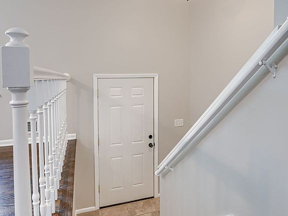 Split entry
Up: 3 bedrooms, 2 full bathrooms, living room, kitchen/dining, and sliding glass door to fenced back yard
Down: 2 additional bedrooms (1 non-conforming), 1 full bath, garage access, and laundry