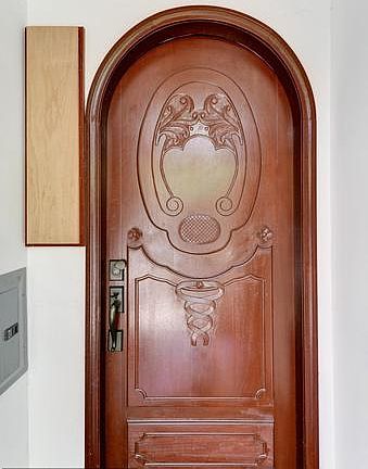 Beautiful Wood Door Leading up to Condo