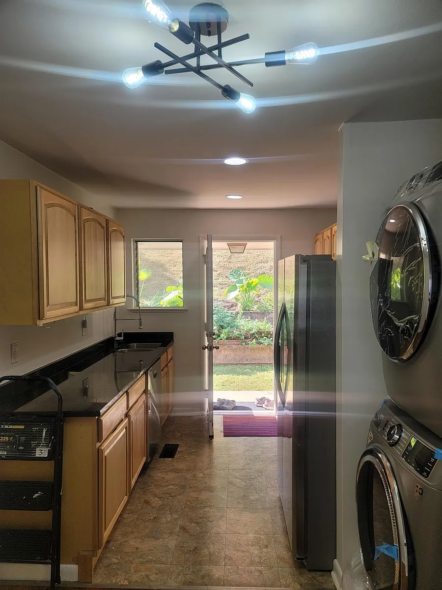 Kitchen equipped with granite countertop and brand name appliances. Open layout includes washer and dryer! - 1123 W Mississippi Ave