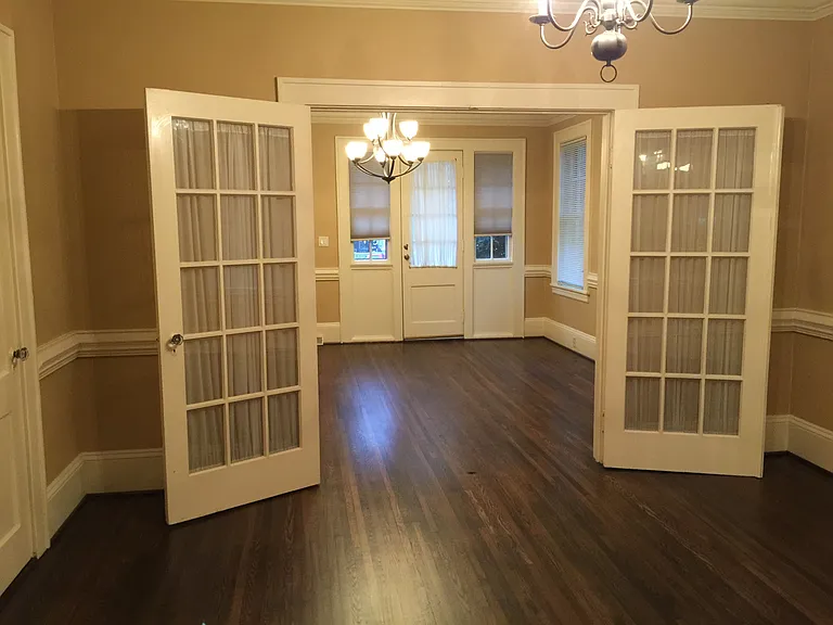 living room with dark stain hardwood floors and french doors