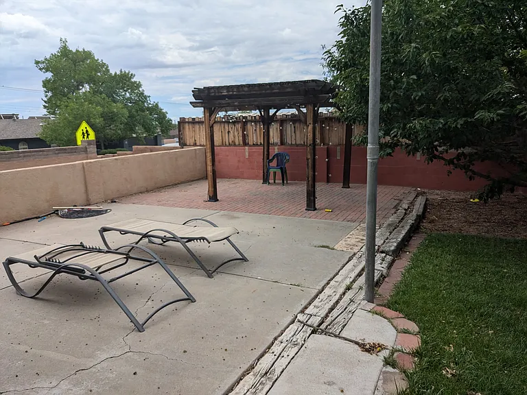 Secondary side patio in backyard (RV parking between backyard and road)