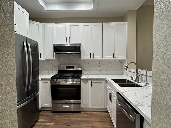 kitchen with new cabinets, countertops and new flooring. All stainless appliances.