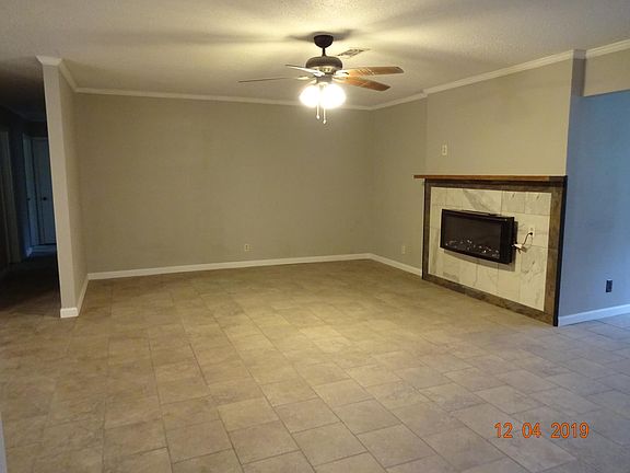 Living room with mantle and electric fireplace