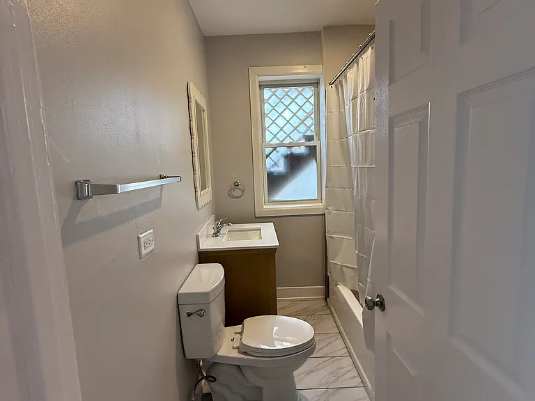 New Bathroom with Custom Tile, Vanity and Tub/Shower