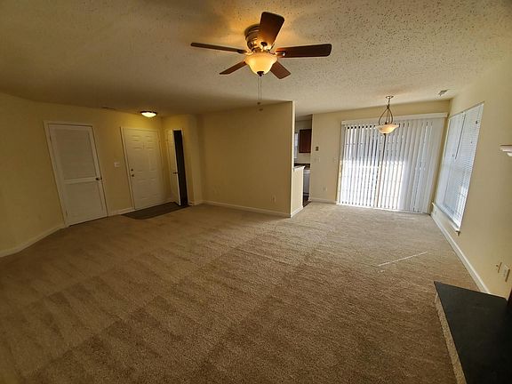 living room and dining area with lots of natural light