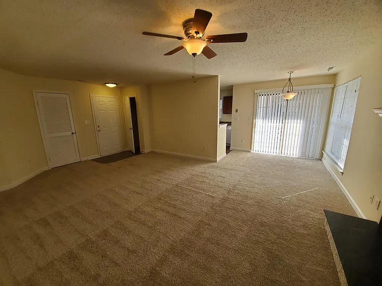 living room and dining area with lots of natural light