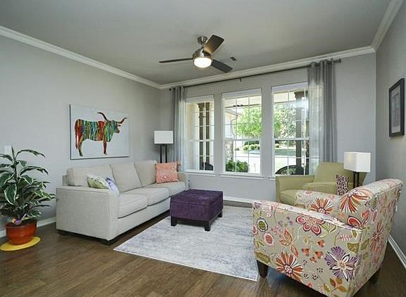 Located beside the Foyer is a light, bright secondary living area which looks to the front of the residence.