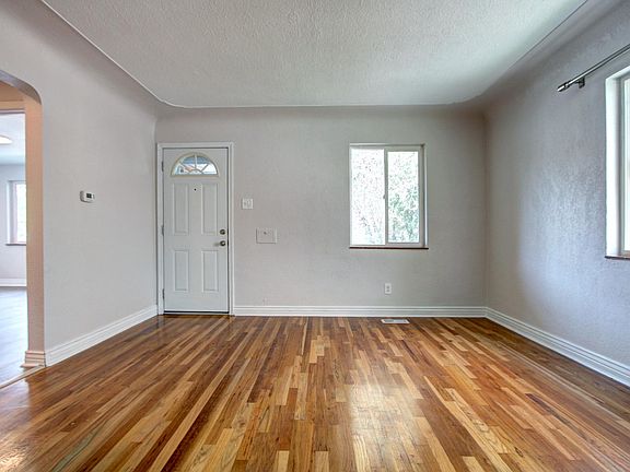 Bright and airy living room with original hardwood floors