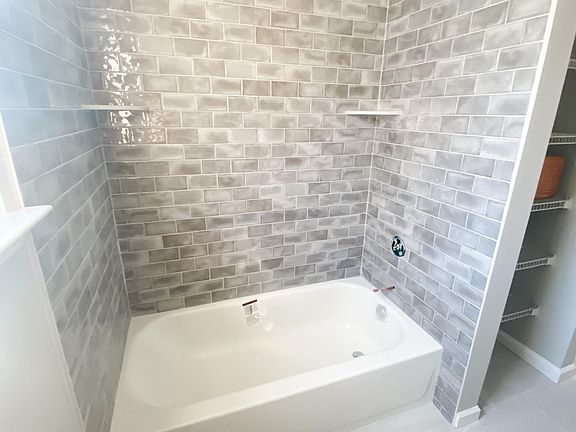 Upstairs full bath, mid-renovation. Finishing touches are being done right now.