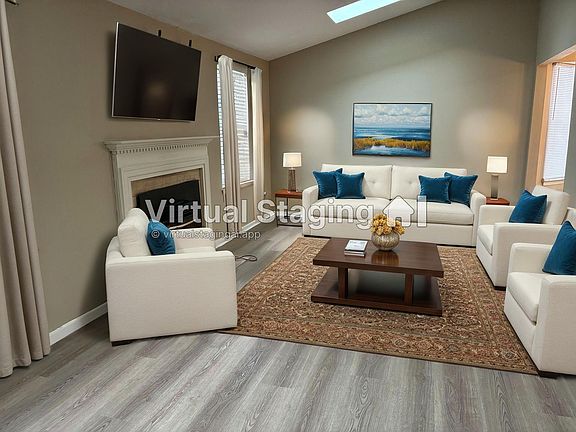 Large vaulted ceiling FR with skylights and pass thru opening into Gorgeous NEW Kitchen