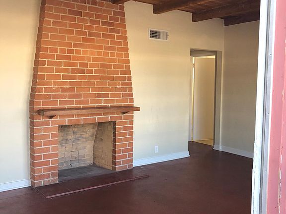 Living room. Fireplace is capped.
