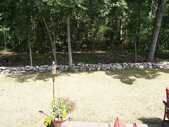 Backyard joins wooded area which offers plenty of privacy