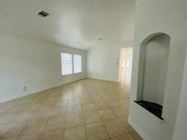Formal living room off entrance with art niche at entrance. (photo taken before new dining room light - see previous photo for new dining room light)