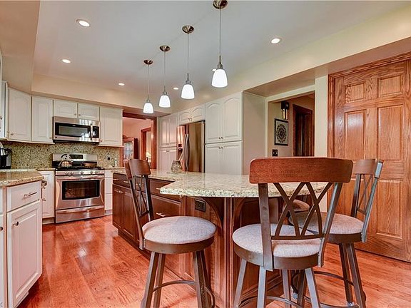 Double Pantries with Pull out Drawers offer plenty of storage space in this Custom Kitchen.