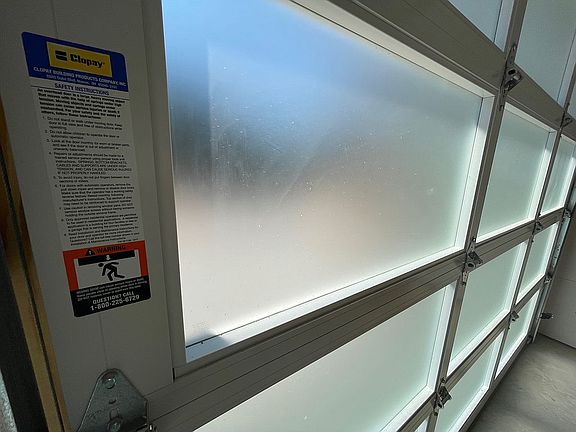 Insulated glass garage doors